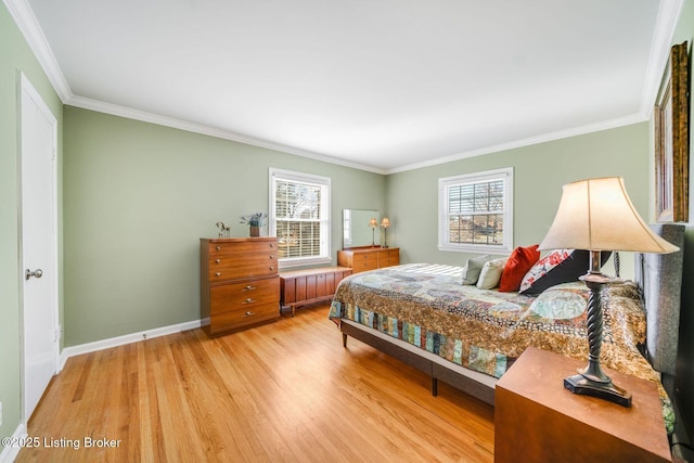 bedroom featuring multiple windows, crown molding, and hardwood / wood-style floors