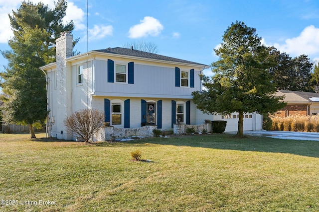 view of front of home featuring a garage and a front lawn