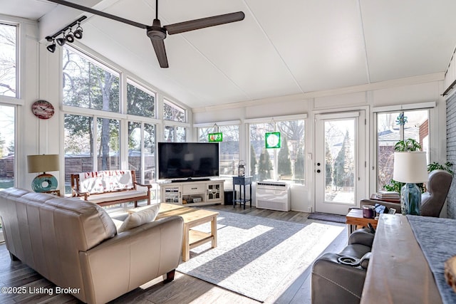 living room with lofted ceiling, dark wood-type flooring, and ceiling fan