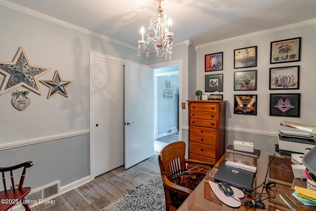 office area featuring ornamental molding, a chandelier, and light hardwood / wood-style floors