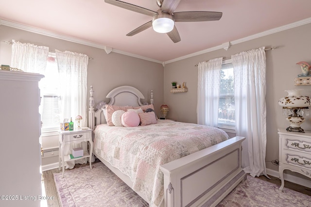 bedroom featuring ornamental molding, light hardwood / wood-style floors, and ceiling fan