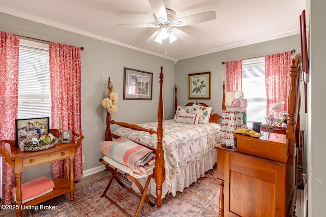 bedroom featuring crown molding, wood-type flooring, and ceiling fan