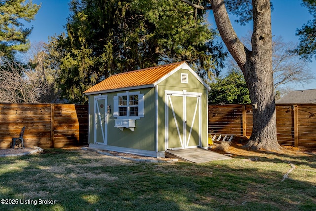 view of outdoor structure featuring a lawn