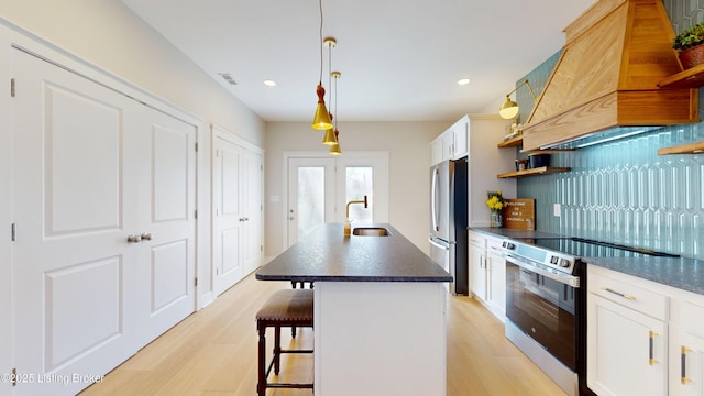 kitchen featuring white cabinetry, premium range hood, appliances with stainless steel finishes, and open shelves