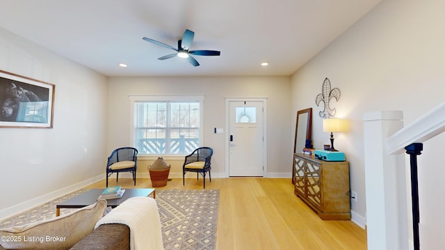 interior space featuring light wood-style floors, baseboards, a ceiling fan, and recessed lighting