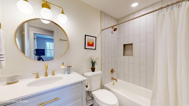 full bathroom with vanity, toilet, and shower / bath combo with shower curtain