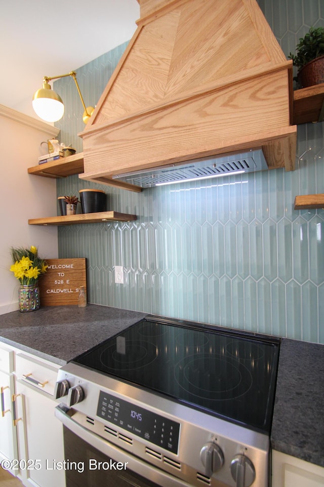 kitchen featuring open shelves, dark countertops, and stainless steel electric stove