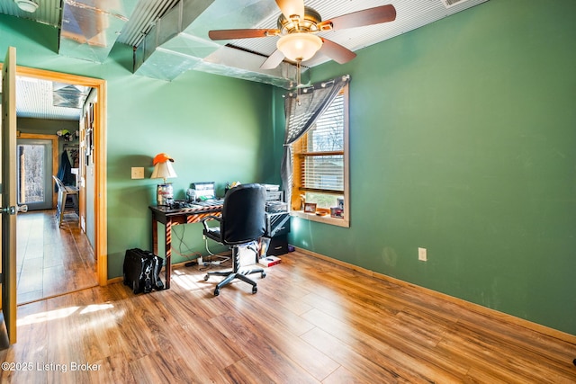 office space with ceiling fan and wood-type flooring