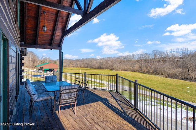 wooden terrace with a yard