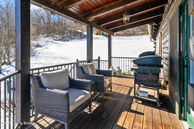 snow covered deck with area for grilling