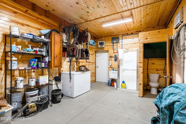 basement with fridge, wooden walls, and wooden ceiling