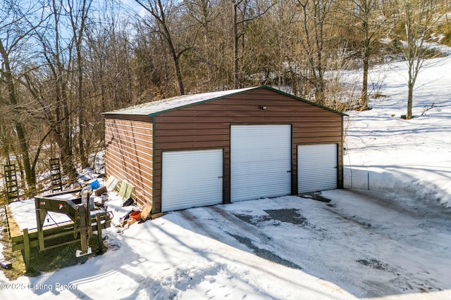 view of snow covered garage