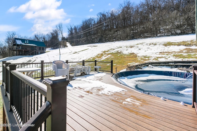 view of snow covered deck