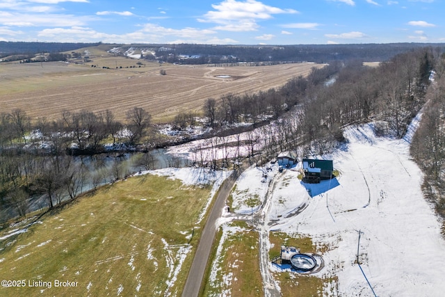 snowy aerial view featuring a rural view