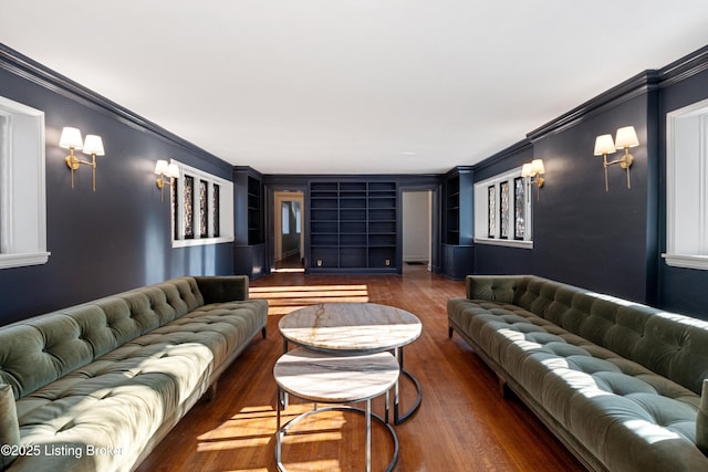 living room featuring crown molding and dark hardwood / wood-style floors