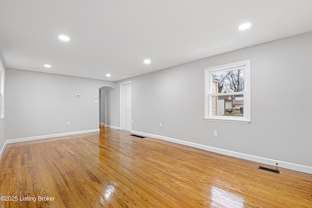 spare room featuring light hardwood / wood-style flooring