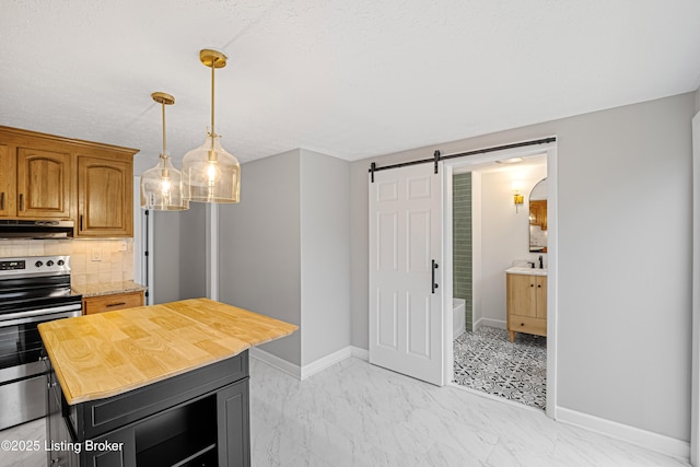 kitchen with wood counters, tasteful backsplash, stainless steel electric range, pendant lighting, and a barn door