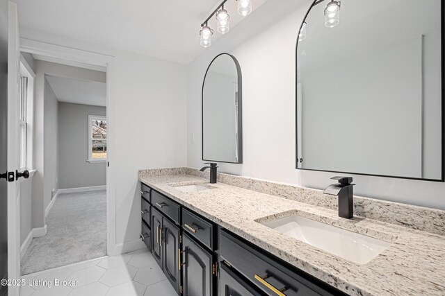 bathroom with tile patterned flooring and vanity