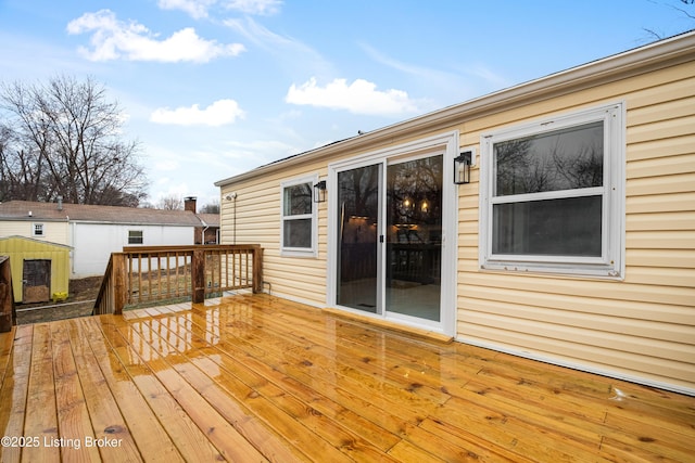 wooden deck with an outbuilding