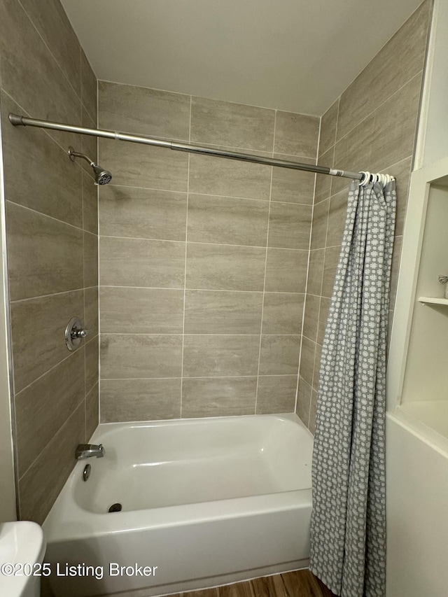 bathroom with shower / bath combo