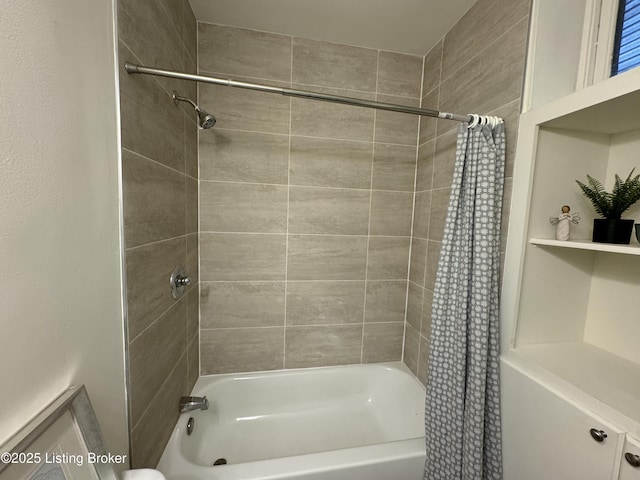 bathroom with shower / bath combo