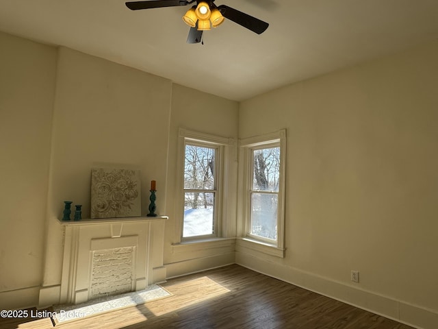 empty room featuring hardwood / wood-style floors and ceiling fan