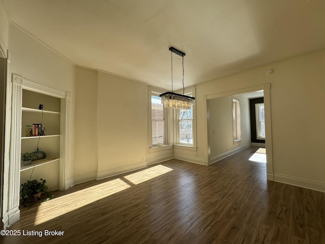 unfurnished dining area featuring dark hardwood / wood-style floors