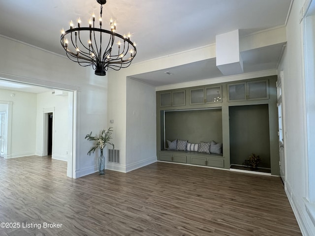 unfurnished room with dark wood-type flooring and crown molding