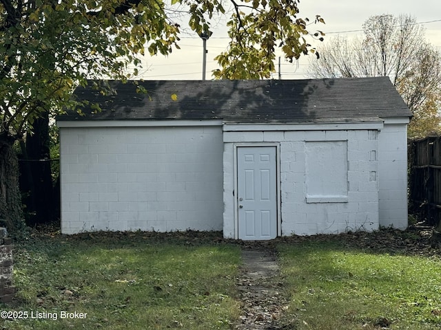 view of outdoor structure with a lawn