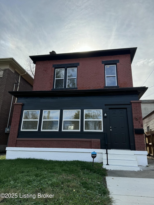 view of property featuring a front yard