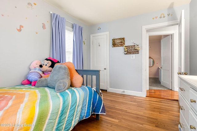 bedroom with light hardwood / wood-style flooring