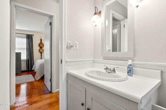 bathroom with vanity and hardwood / wood-style flooring