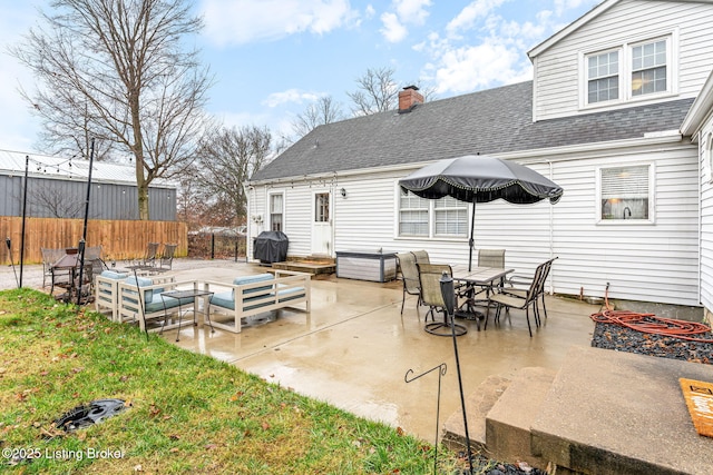 back of property with a patio