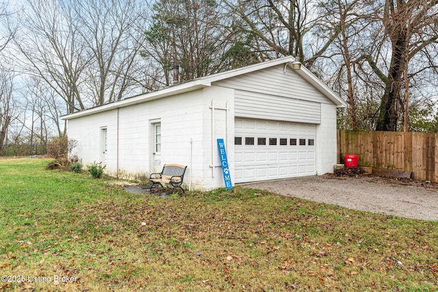 garage featuring a lawn