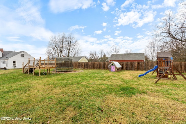 view of yard with a playground and a deck