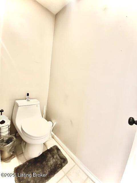 bathroom featuring tile patterned floors and toilet