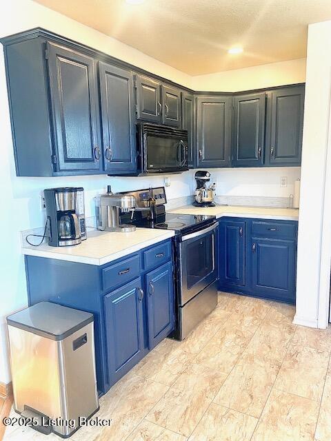 kitchen featuring blue cabinets and stainless steel range with electric stovetop