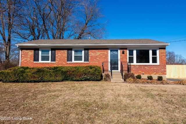 ranch-style house with a front lawn