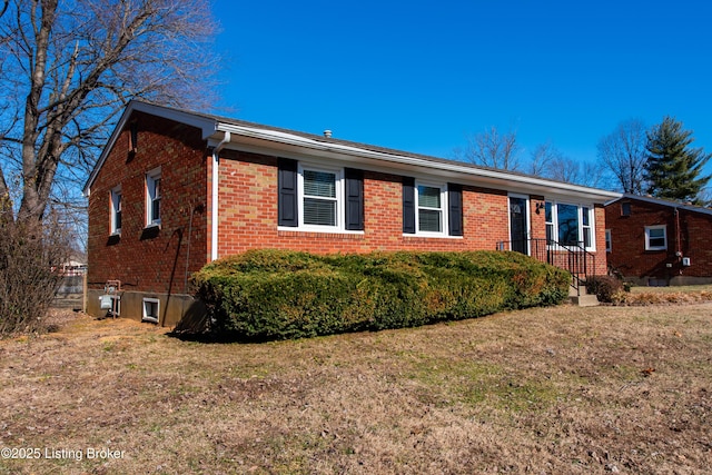 ranch-style home with a front lawn