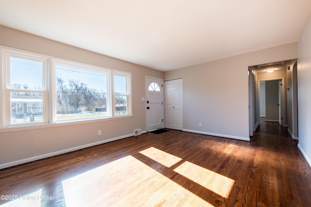 foyer entrance featuring dark hardwood / wood-style flooring