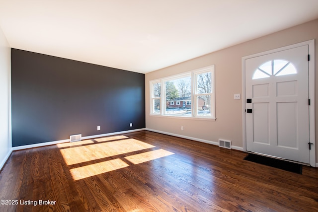 foyer entrance featuring dark wood-type flooring