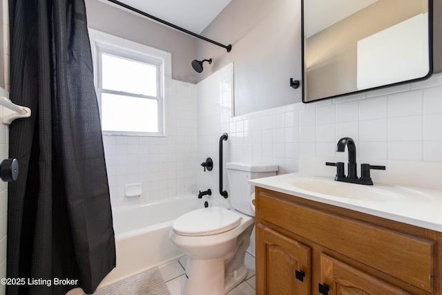 full bathroom with tasteful backsplash, tile walls, tile patterned flooring, vanity, and shower / tub combo