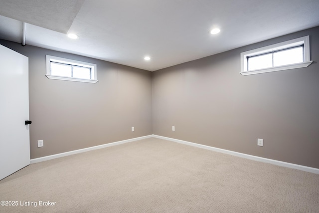 basement featuring a healthy amount of sunlight and carpet flooring