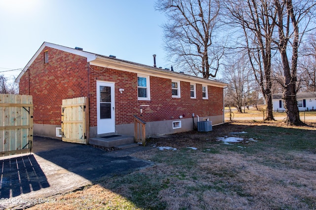 back of house featuring central AC unit