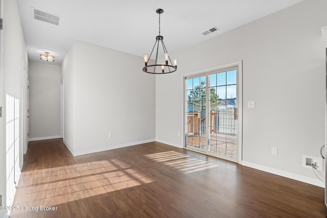 unfurnished dining area featuring visible vents and wood finished floors