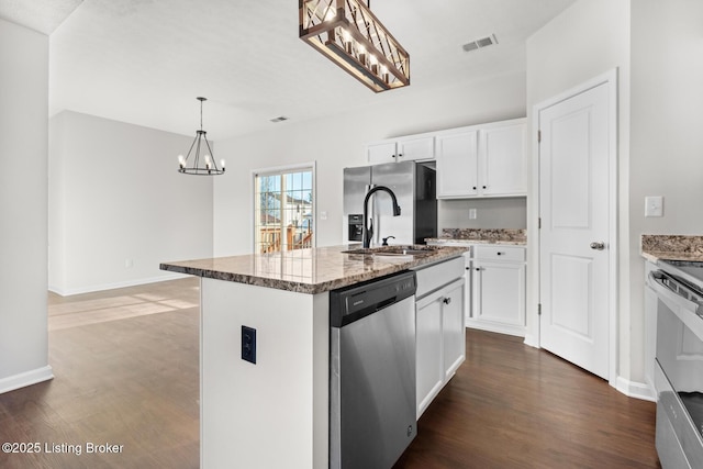 kitchen featuring light stone counters, visible vents, white cabinets, appliances with stainless steel finishes, and dark wood finished floors