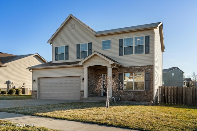 view of front facade with an attached garage, brick siding, fence, driveway, and a front yard