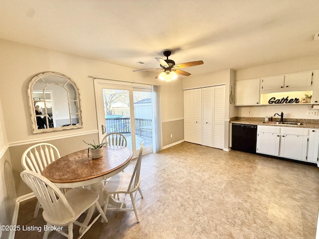 dining area featuring ceiling fan and sink