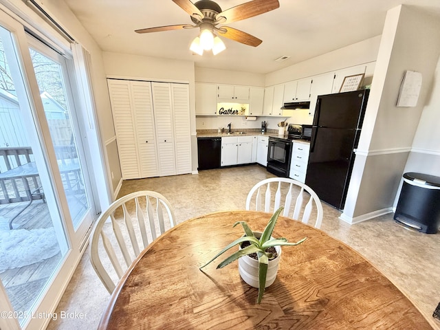 kitchen featuring ceiling fan, white cabinets, sink, and black appliances