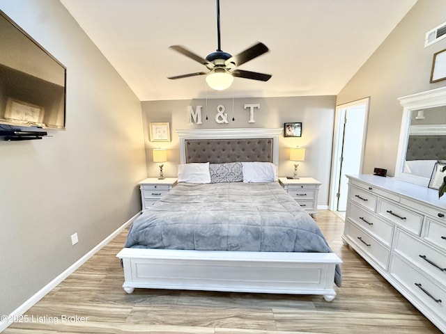 bedroom with lofted ceiling, light hardwood / wood-style floors, and ceiling fan